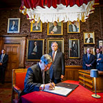 HM Emperor Naruhito of Japan signs the Visitors’ Book of the Court in the Red Room of the Peace Palace